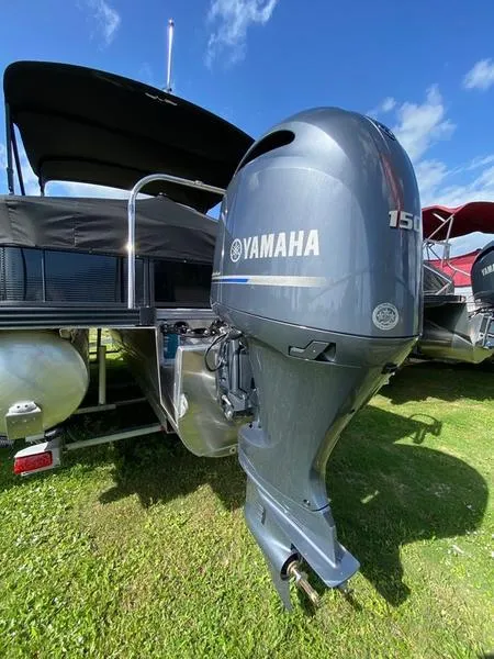 Slide: The Image of 2021 Manitou 21 AURORA LE RF VP pontoon boat with Yamaha 150 outboard motor. - 13