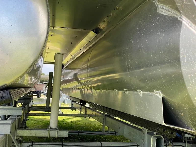 Slide: The Image of 2021 Manitou 21 AURORA LE RF VP pontoon boat underside on trailer. - 16