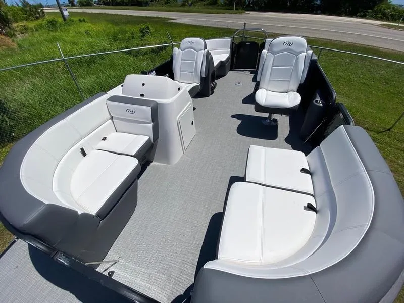 Slide: The Image of 2021 Manitou 21 AURORA LE RF VP pontoon boat interior with white seating. - 17