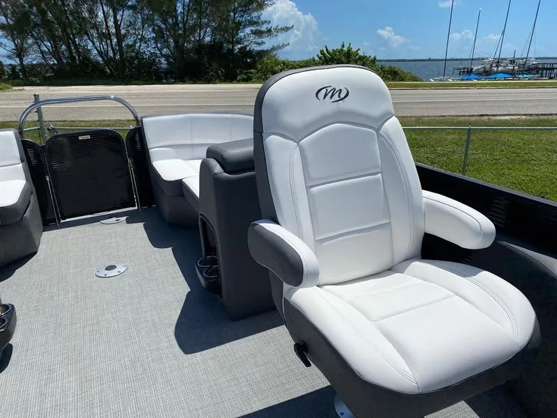 Slide: The Image of 2021 Manitou 21 AURORA LE RF VP pontoon boat interior with white seating. - 18