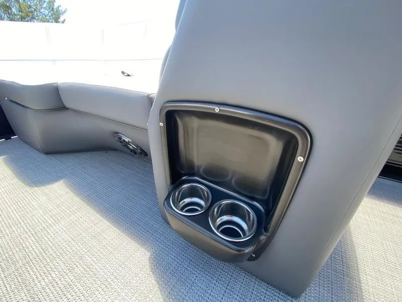 Slide: The Image of 2021 Manitou 21 AURORA LE RF VP boat interior with cup holders. - 25