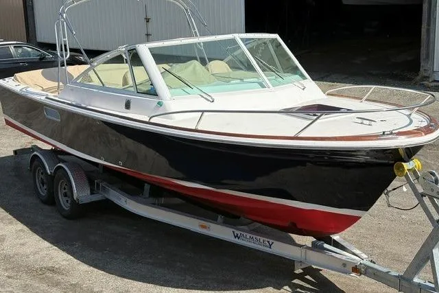 Slide: The Image of 2006 Hunt Yachts Harrier 25 boat on trailer, featuring sleek design and classic styling. - 3