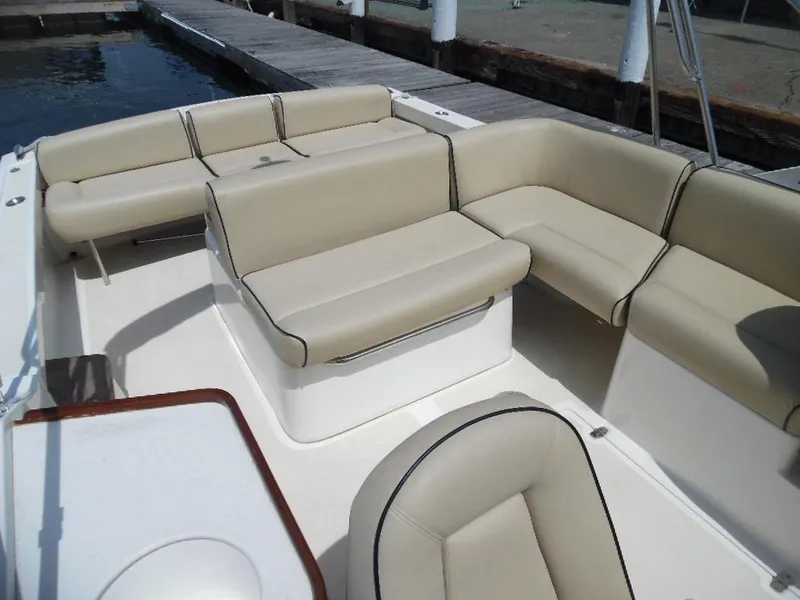 Slide: The Image of Interior of a 2006 Hunt Yachts Harrier 25 with beige seating. - 5