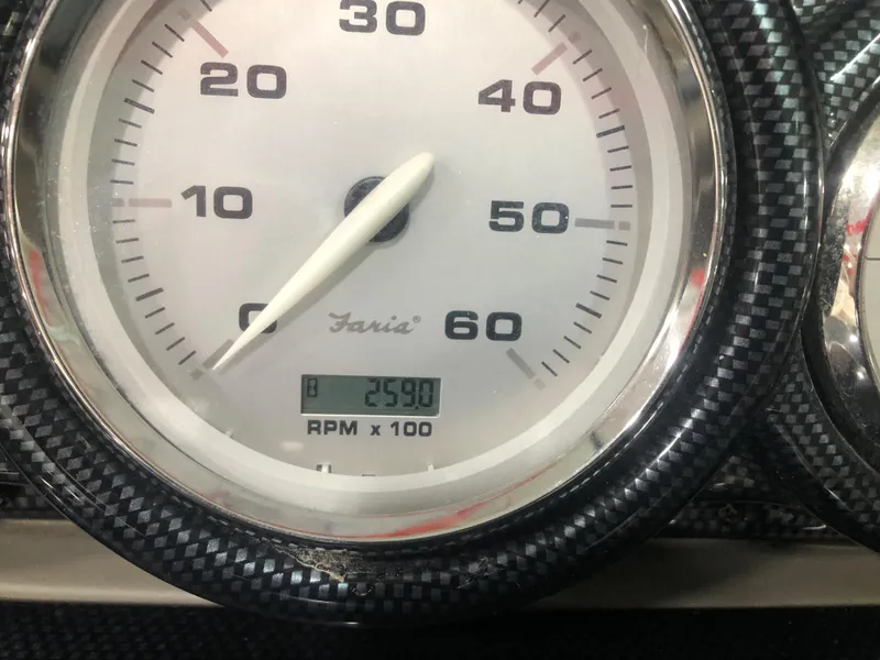 Slide: The Image of Close-up of a Faria tachometer showing 2590 RPM, Azure 258 model, 2010. - 11