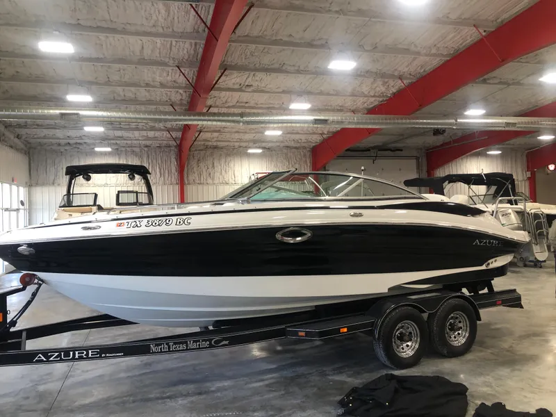 Slide: The Image of 2010 Azure 258 boat on trailer in indoor storage facility. - 4
