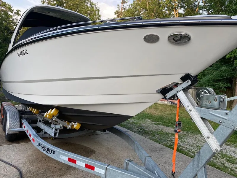Slide: The Image of 2015 Monterey 288 Super Sport boat on trailer, parked outdoors. - 10