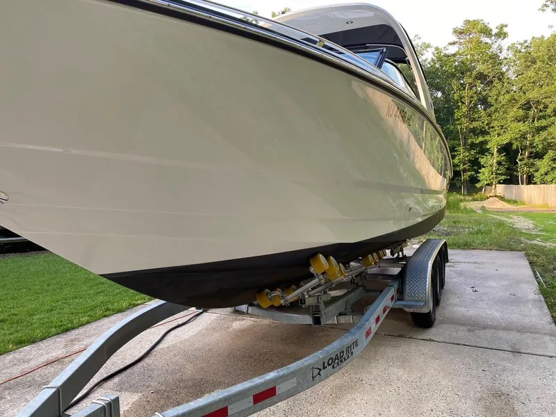 Slide: The Image of 2015 Monterey 288 Super Sport boat on trailer, parked outdoors. - 3