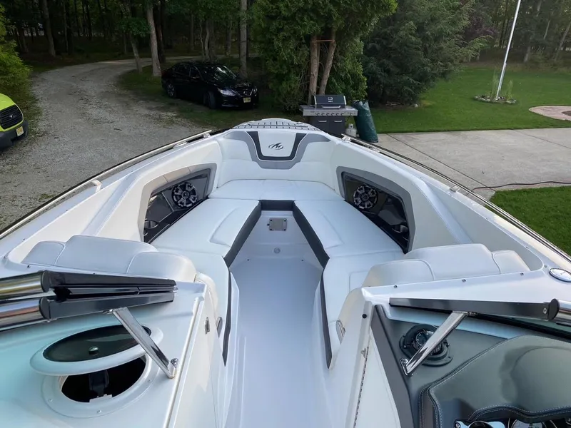 Slide: The Image of 2015 Monterey 288 Super Sport boat interior with white seating and sleek design. - 8