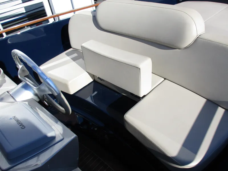 Slide: The Image of 2005 Riva 33 SUNRIVA boat interior with beige leather seating and Garmin navigation system. - 14