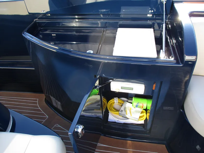 Slide: The Image of 2005 Riva 33 SUNRIVA yacht interior storage compartment with electrical equipment and cables. - 16