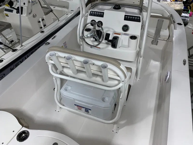 Slide: The Image of 2024 Robalo 206 Cayman boat interior with steering console and seating. - 14