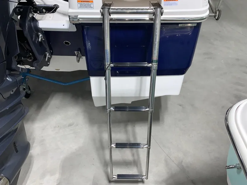 Slide: The Image of 2024 Robalo 206 Cayman boat with extended stainless steel ladder. - 15