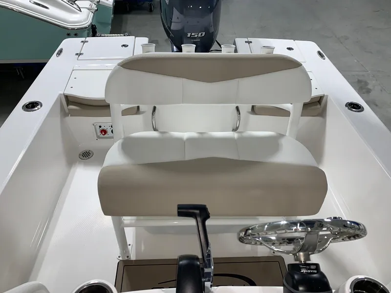 Slide: The Image of 2024 Robalo 206 Cayman boat interior with dual seating and steering console. - 8