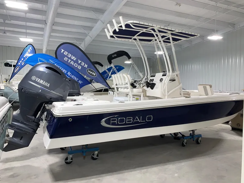Slide: The Image of 2024 Robalo 206 Cayman boat with Yamaha engine in showroom. - 0