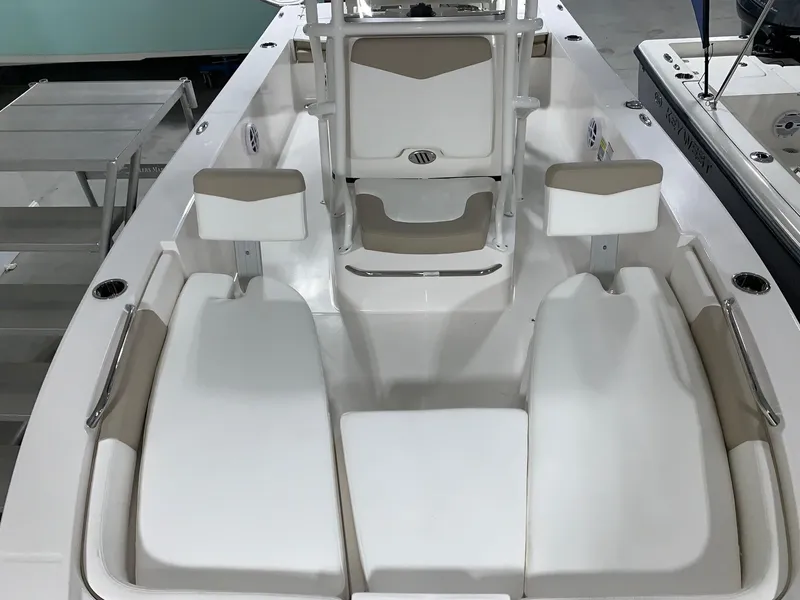 Slide: The Image of 2024 Robalo 206 Cayman boat interior with white and beige seating. - 3