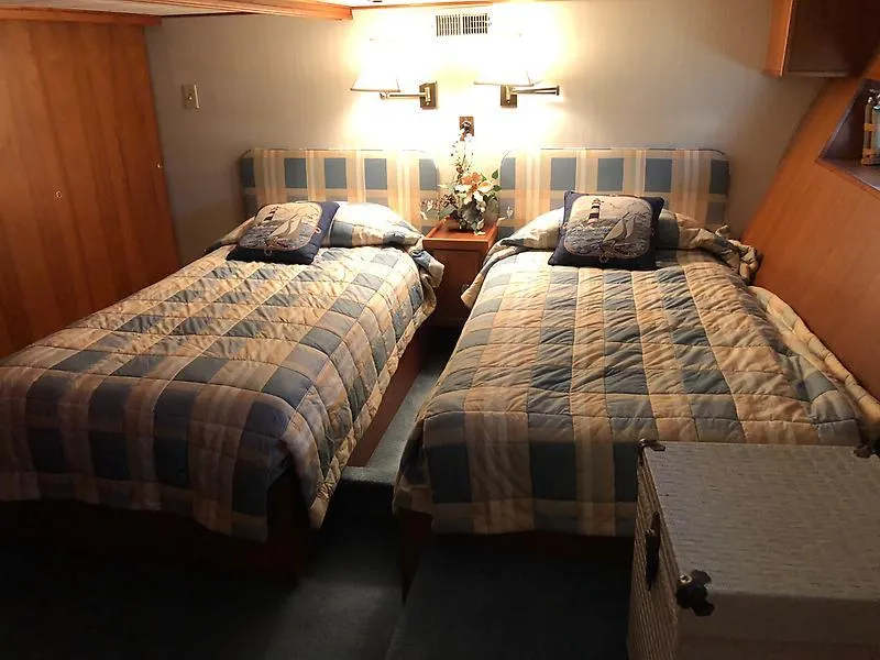 Slide: The Image of Twin beds in the 1989 Pluckebaum 75 Coastal Cruiser cabin. - 15