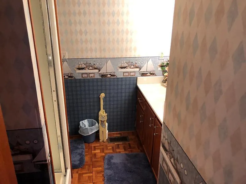 Slide: The Image of Bathroom interior of 1989 Pluckebaum 75 Coastal Cruiser with nautical-themed wallpaper. - 28