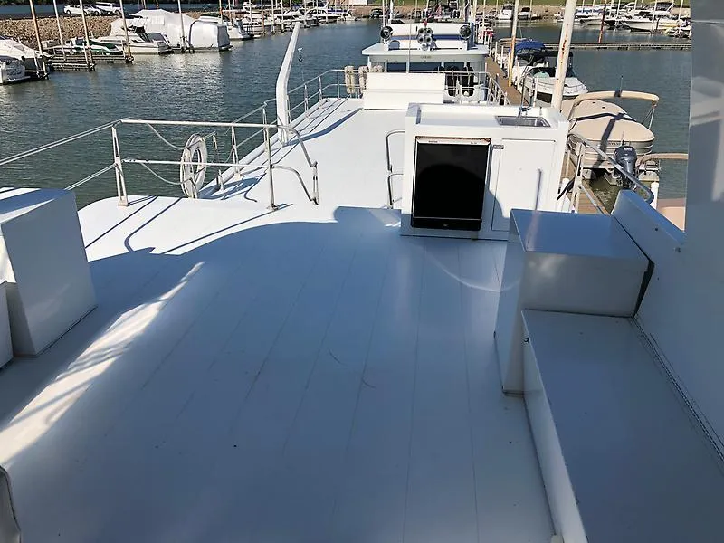 Slide: The Image of 1989 Pluckebaum 75 Coastal Cruiser upper deck with marina view. - 29