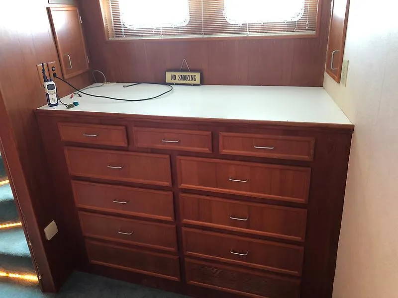 Slide: The Image of Wooden dresser with multiple drawers on a 1989 Pluckebaum 75 Coastal Cruiser yacht. - 3