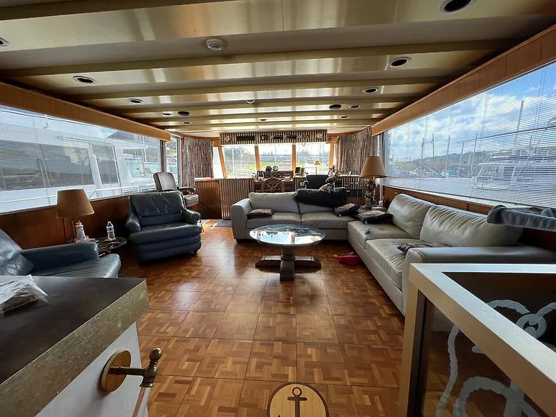 Slide: The Image of Luxurious interior of 1989 Pluckebaum 75 Coastal Cruiser with spacious seating area. - 7