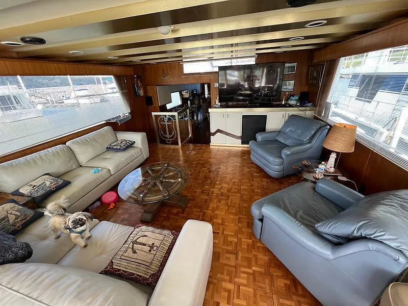 Slide: The Image of Luxurious interior of 1989 Pluckebaum 75 Coastal Cruiser with leather seating and panoramic windows. - 9