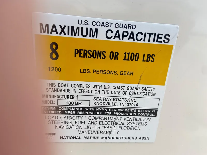 Slide: The Image of U.S. Coast Guard capacity label for 2000 Sea Ray 180BR boat, 8 persons or 1100 lbs. - 10
