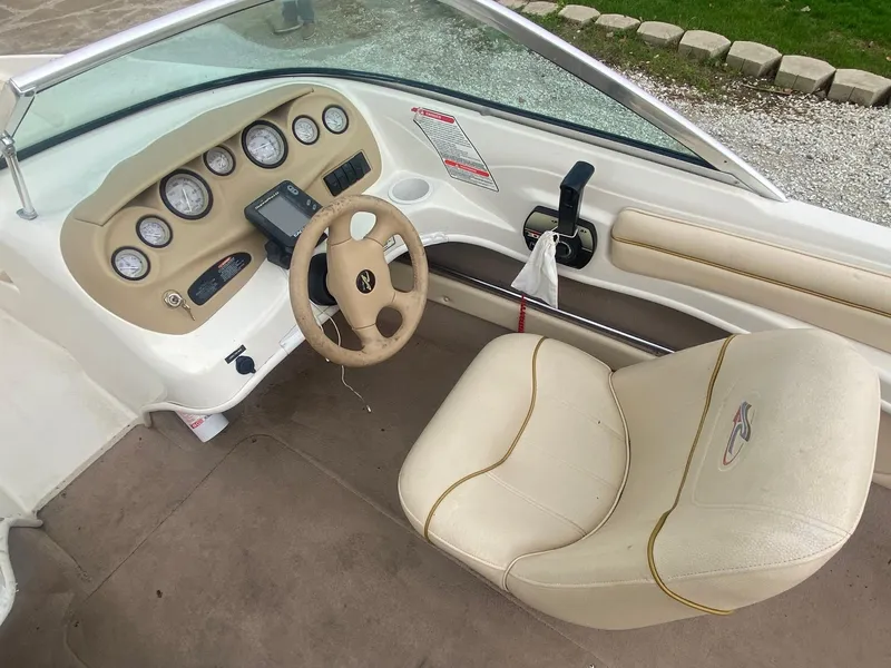 Slide: The Image of Interior of a 2000 Sea Ray 180BR boat showing steering wheel and dashboard. - 11