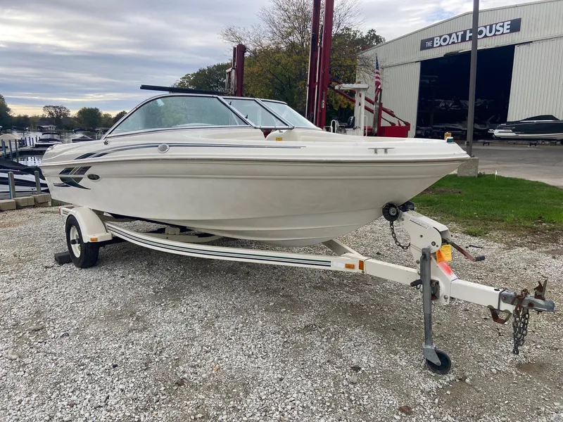 Slide: The Image of 2000 Sea Ray 180BR boat on trailer at marina. - 3