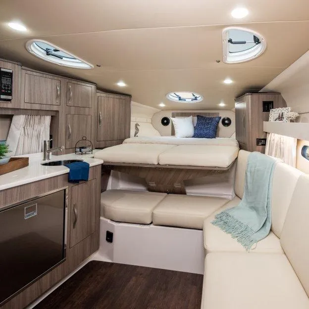 Slide: The Image of Luxurious interior of 2022 Regal 33 XO yacht with modern amenities and cozy seating. - 15