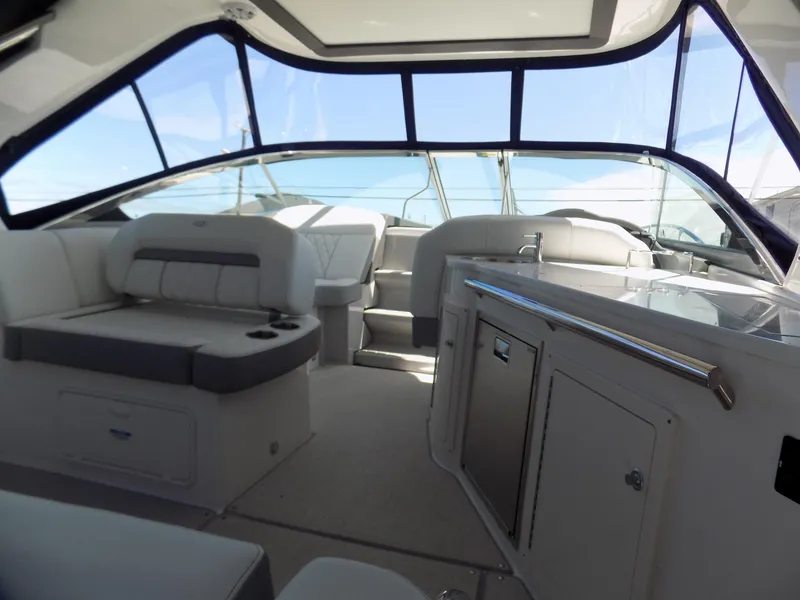 Slide: The Image of Interior of 2022 Regal 33 XO boat with seating and kitchenette. - 4
