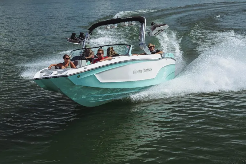 Slide: The Image of 2023 MasterCraft XT24 boat cruising on water with passengers. - 11