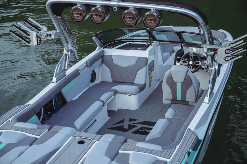 Slide: The Image of 2023 MasterCraft XT24 boat interior with seating and wakeboard tower. - 36