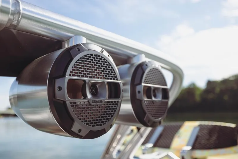 Slide: The Image of Close-up of 2023 MasterCraft XT24 boat speakers on a sunny day. - 38