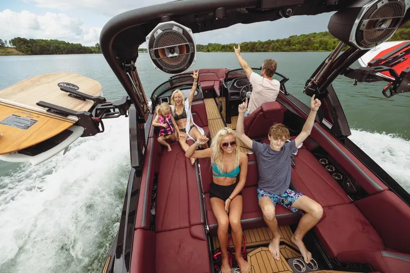 Slide: The Image of 2023 MasterCraft XStar S boat with passengers enjoying a day on the water. - 14
