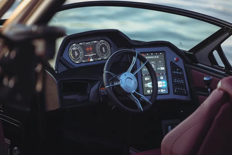 Slide: The Image of 2023 MasterCraft XStar S boat dashboard with advanced controls and touchscreen display. - 15