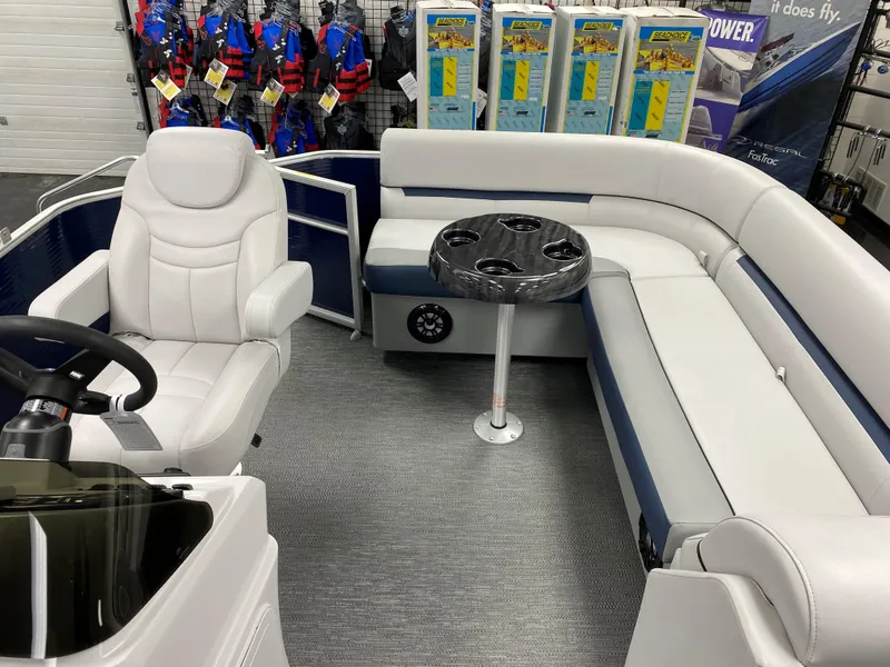 Slide: The Image of 2022 Godfrey Sweetwater 2186 C4 pontoon boat interior with white seating and cup holders. - 8