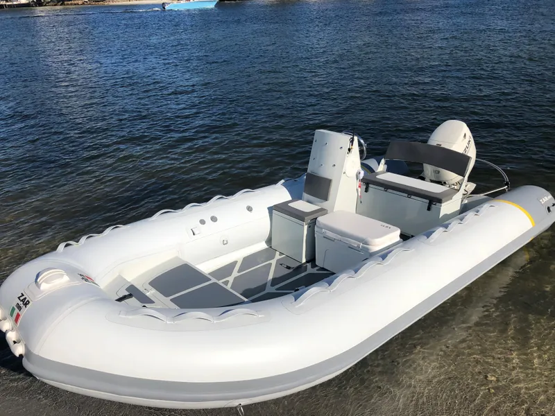 Slide: The Image of 2024 ZAR Mini RIB 16 inflatable boat on calm water. - 4