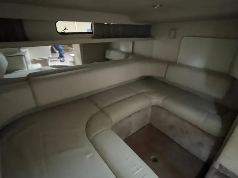 Slide: The Image of Interior cabin of a 2002 Formula 31 PC boat with beige seating. - 13