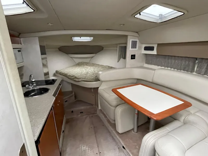 Slide: The Image of 2002 Formula 31 PC cabin interior with kitchenette, dining area, and bed. - 9