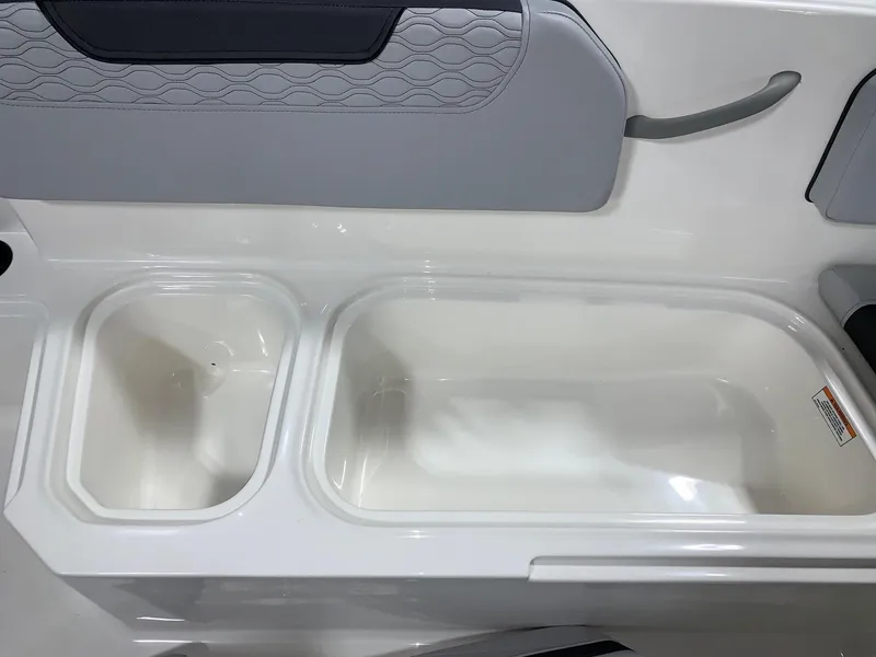 Slide: The Image of 2024 Bayliner Element M15 boat storage compartments and seating area. - 10