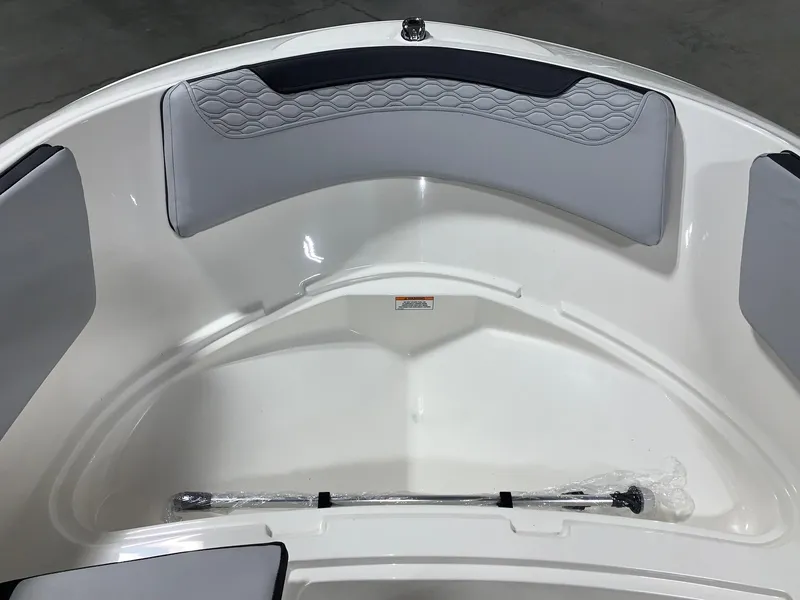 Slide: The Image of 2024 Bayliner Element M15 boat interior with gray cushioned seating. - 11
