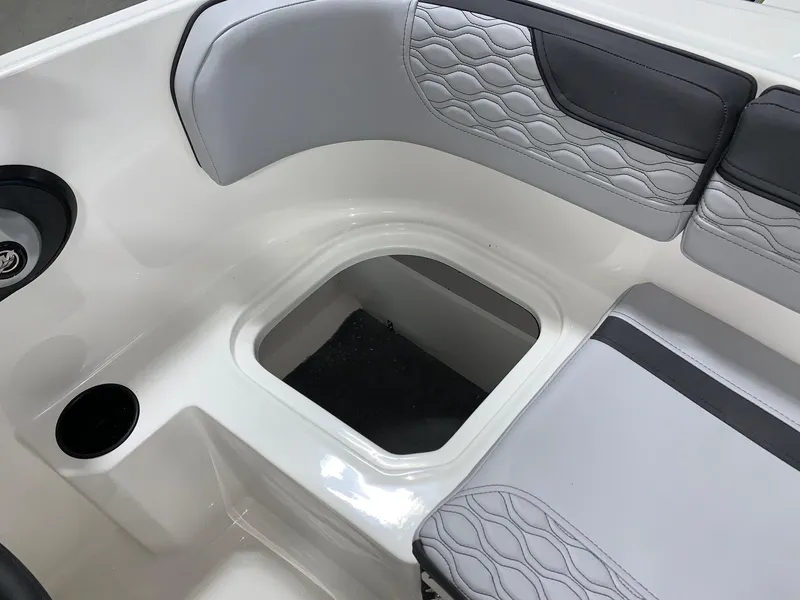 Slide: The Image of 2024 Bayliner Element M15 boat interior seating and storage compartment. - 9