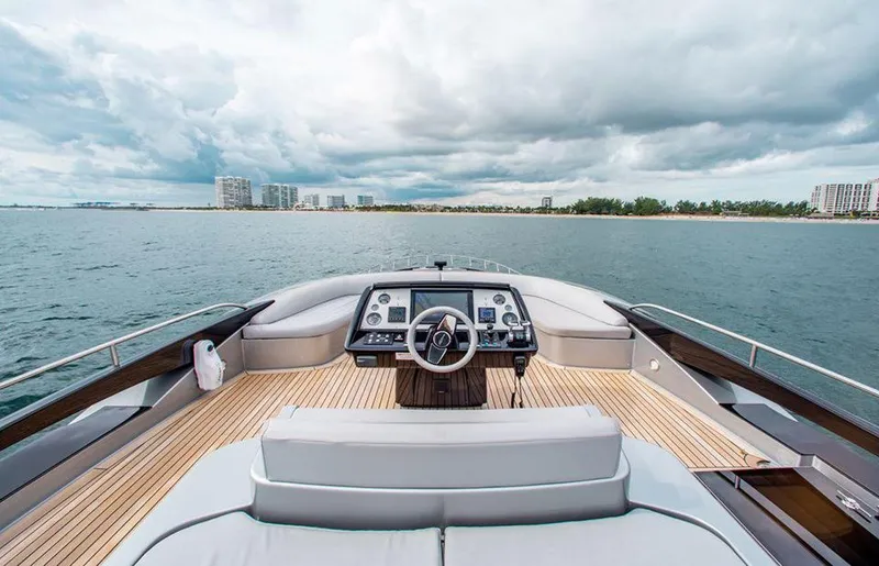 Slide: The Image of Cockpit view of 2017 Riva 88 Domino Super yacht on open water. - 16