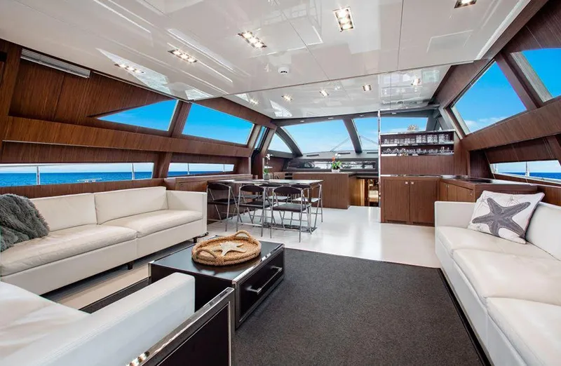 Slide: The Image of Luxurious interior of 2017 Riva 88 Domino Super yacht with modern furnishings and panoramic windows. - 26