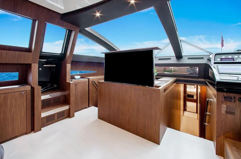 Slide: The Image of Interior of 2017 Riva 88 Domino Super yacht with modern wood finishes and large windows. - 30