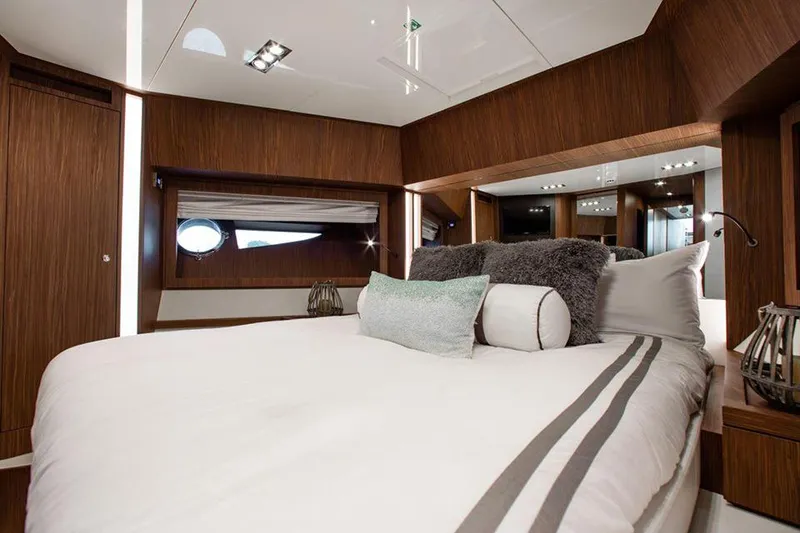 Slide: The Image of Luxurious bedroom interior of 2017 Riva 88 Domino Super yacht with modern wood finish. - 38