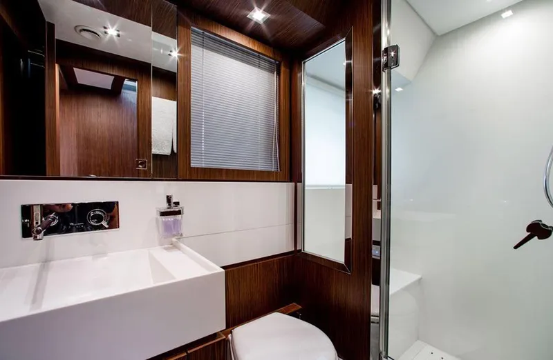 Slide: The Image of Modern bathroom in 2017 Riva 88 Domino Super yacht with sleek wood paneling. - 40