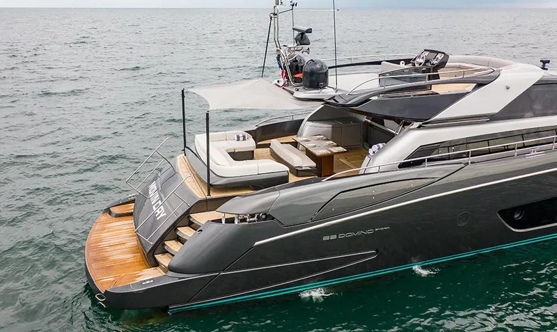 Slide: The Image of 2017 Riva 88 Domino Super luxury yacht on the water. - 8