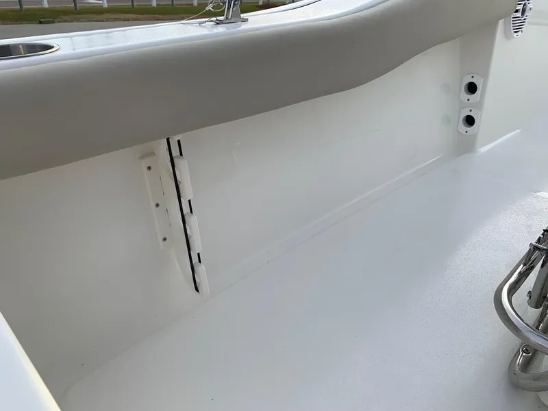 Slide: The Image of 2024 Key West 179 FS boat interior detail showing clean white finish and hardware. - 10