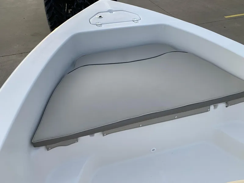 Slide: The Image of 2024 Key West 179 FS boat bow seating area with gray cushion. - 17